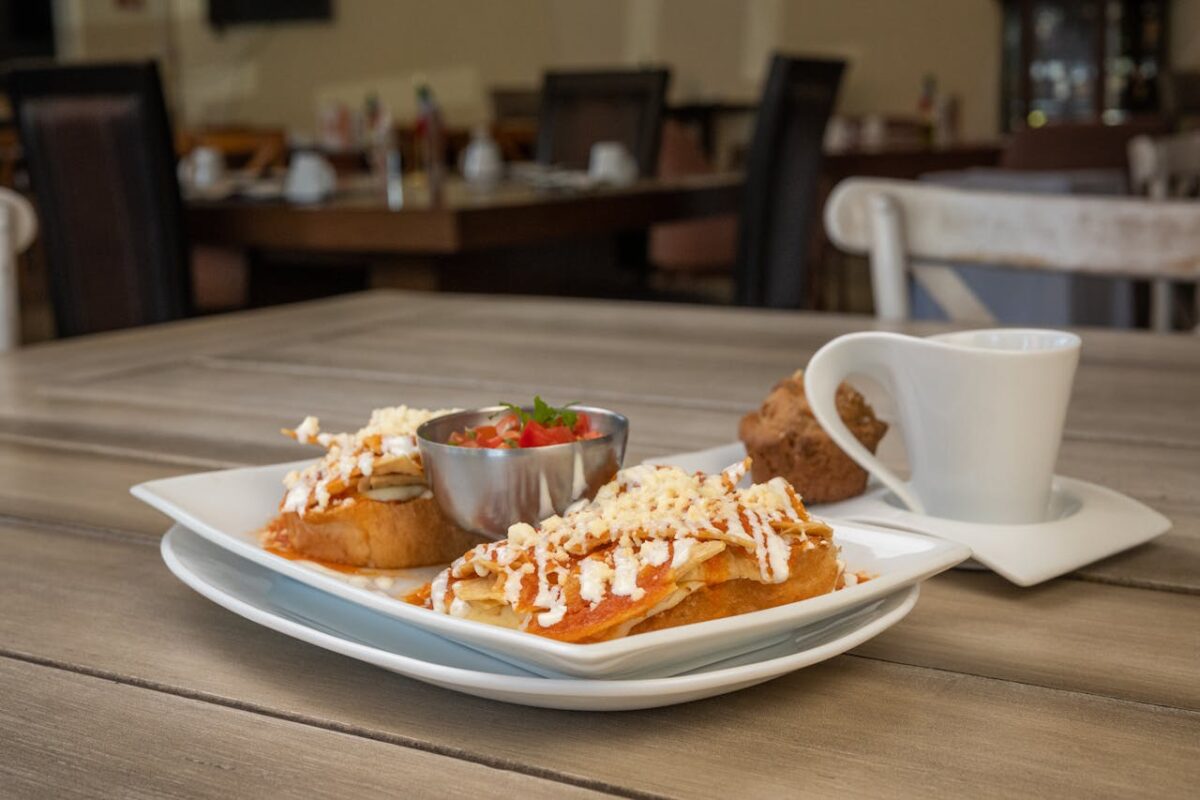 Savor authentic chilaquiles with salsa, cheese, and coffee in a Salamanca café.